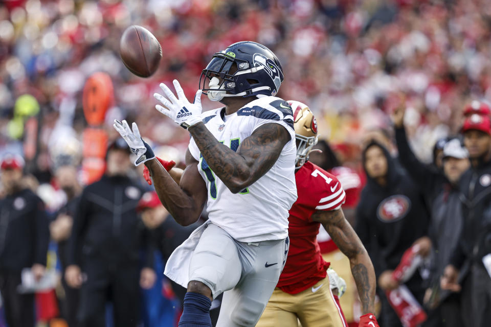 Seattle Seahawks wide receiver DK Metcalf (14) catches a touchdown pass in front of San Francisco 49ers cornerback Charvarius Ward during the first half of an NFL wild card playoff football game in Santa Clara, Calif., Saturday, Jan. 14, 2023. (AP Photo/Josie Lepe)