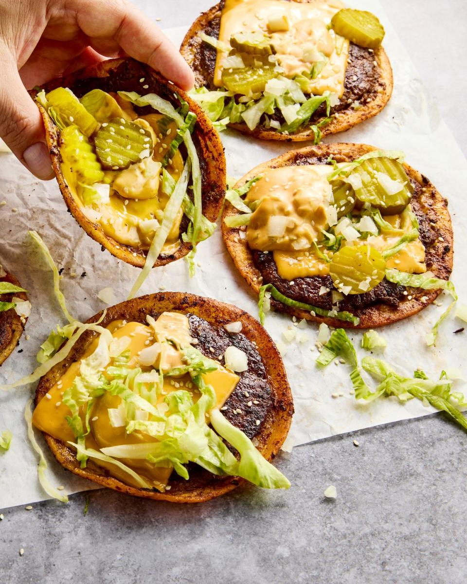 the ultimate comfort food hybrid with a crispy, juicy, thin beef patty, melty american cheese, and all the classic burger fixings loaded onto a toasted flour tortilla