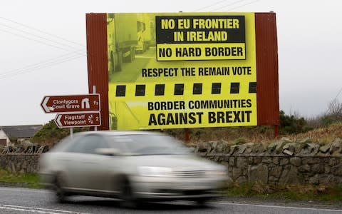 A motorist crosses over the border from the Irish Republic into Northern Ireland near the town of Jonesborough - Credit:  Peter Morrison