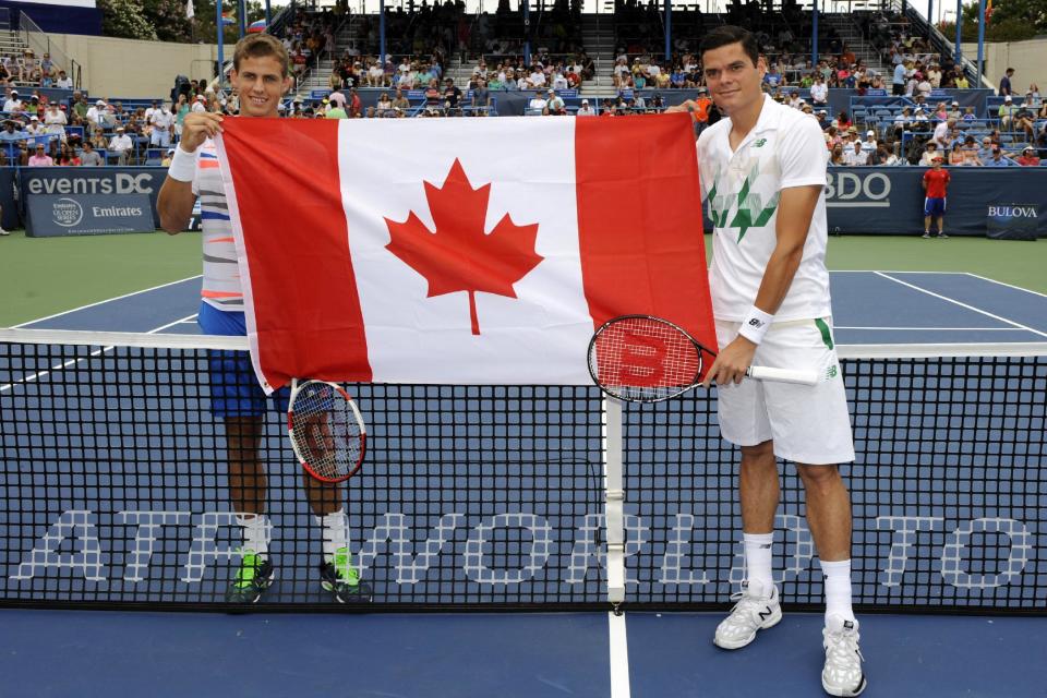 Vasek Pospisil, left, and Milos Raonic, right, both of Canada, pose before the men's singles final at the Citi Open tennis tournament, Sunday, Aug. 3, 2014, in Washington. Raonic won 6-1, 6-4. (AP Photo/Nick Wass)