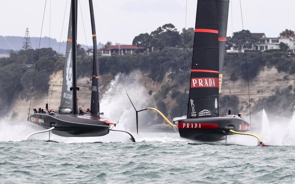 Italy's Luna Rossa, right, leads Britain's INEOS Team UK to win race three of the Prada Cup on Auckland's Waitemata Harbour, New Zealand, Sunday, Feb.14, 2021. (Brett Phibbs/NZ Herald via AP)