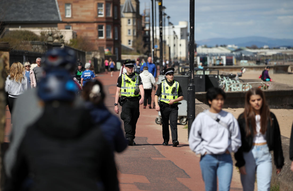 Police officers patrol the beach front at Portobello as the UK continues in lockdown to help curb the spread of the coronavirus.