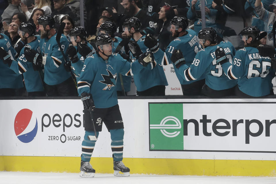 San Jose Sharks left wing Patrick Marleau, foreground, is congratulated by teammates after scoring a goal against the Anaheim Ducks during the second period of an NHL hockey game in San Jose, Calif., Monday, Jan. 27, 2020. (AP Photo/Jeff Chiu)