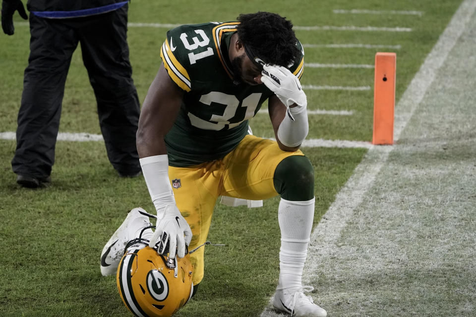 Green Bay Packers' Adrian Amos pauses after losing the NFC championship NFL football game to the Tampa Bay Buccaneers in Green Bay, Wis., Sunday, Jan. 24, 2021. The Buccaneers defeated the Packers 31-26 to advance to the Super Bowl. (AP Photo/Morry Gash)