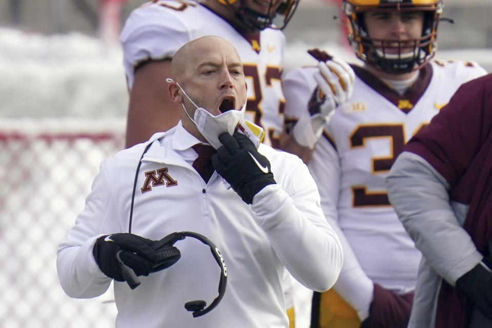 FILE - In this Dec. 12, 2020, file photo, Minnesota head coach P.J. Fleck yells instructions during the second half of an NCAA college football game against Nebraska in Lincoln, Neb. Fleck and other college coaches across the country communicated with recruits via Zoom and offered virtual campus tours to prospects as pandemic-imposed restrictions prevented face-to-face contact. (AP Photo/Nati Harnik, File)