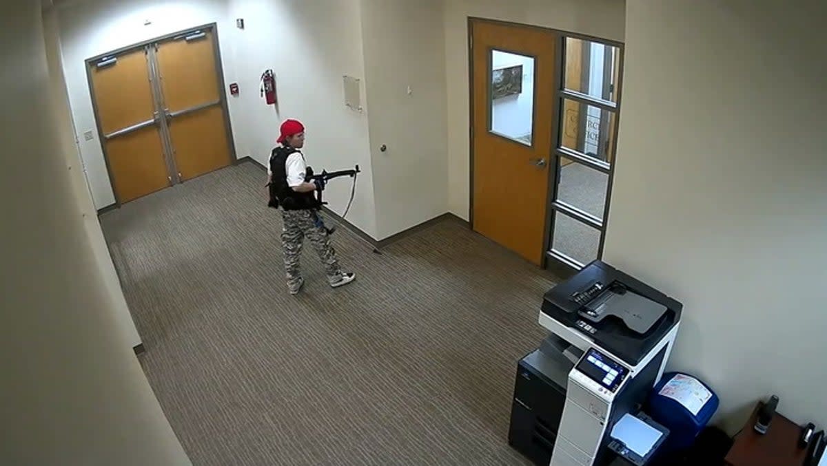Surveillance footage shows the shooter walking through a school corridor holding a gun (Metro Nashville PD)