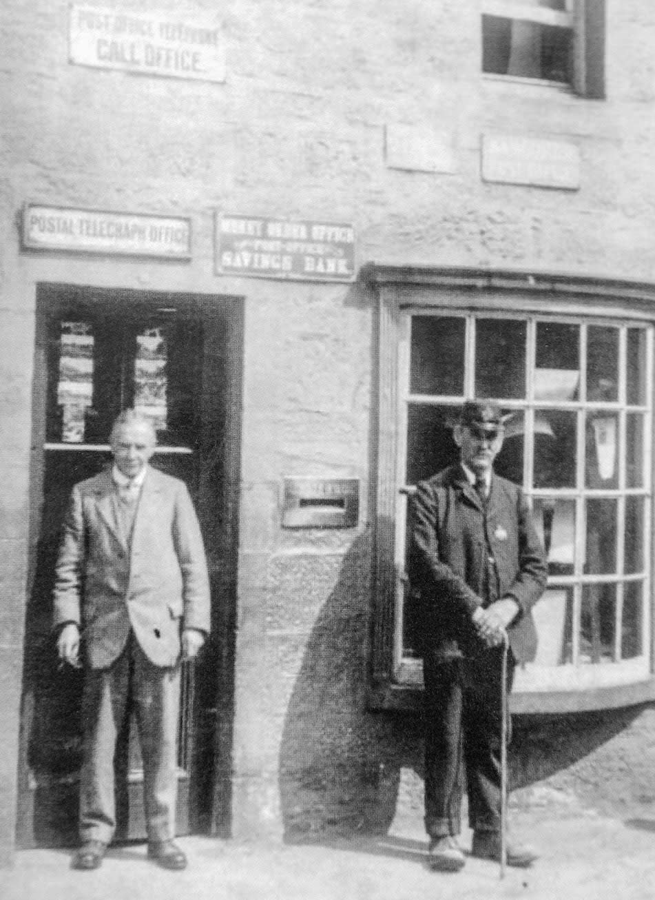 Matthew Hogart, postmaster from 1908 to 1983, and postman George Stoddart at Sanquhar Post Office (Picture: SWNS)