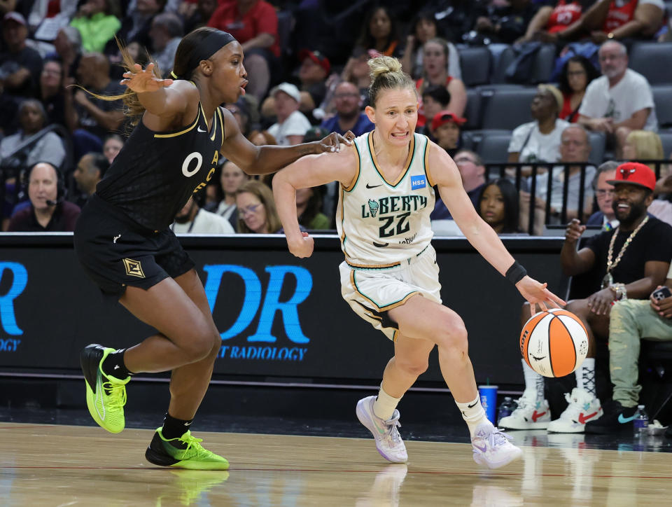 New York Liberty guard Courtney Vandersloot drives against Las Vegas Aces guard Jackie Young during their first meeting this seasonon June 29, 2023, at Michelob ULTRA Arena in Las Vegas. The Aces won, 98-81. (Ethan Miller/Getty Images)