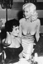 <p>If Sophia Loren looks like she's giving Jayne Mansfield some side eye, that's because she is. Sophia later told <a href="http://www.ew.com/article/2014/11/03/sophia-loren-jayne-mansfield" rel="nofollow noopener" target="_blank" data-ylk="slk:Entertainment Weekly" class="link ">Entertainment Weekly</a> she was worried Jayne's nipples were going to fall out of her dress."In my face you can see the fear. I'm so frightened that everything in her dress is going to blow — <em>BOOM! </em>— and spill all over the table."</p>