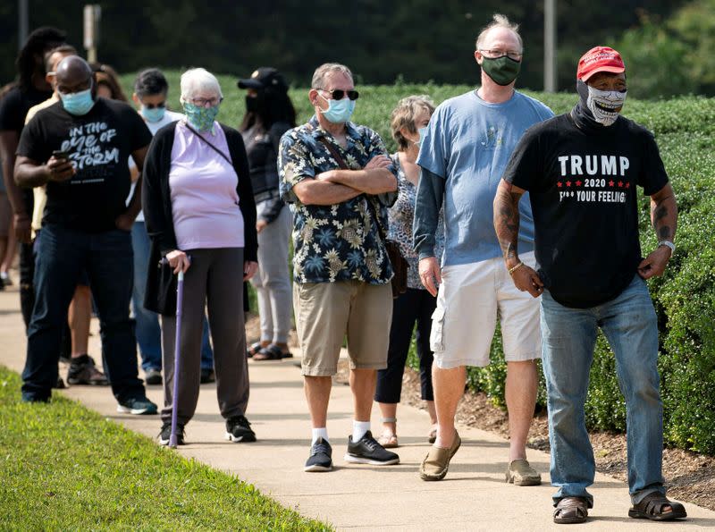 FILE PHOTO: People vote at an early voting site for the 2020 U.S. presidential election in Fairfax, Virginia