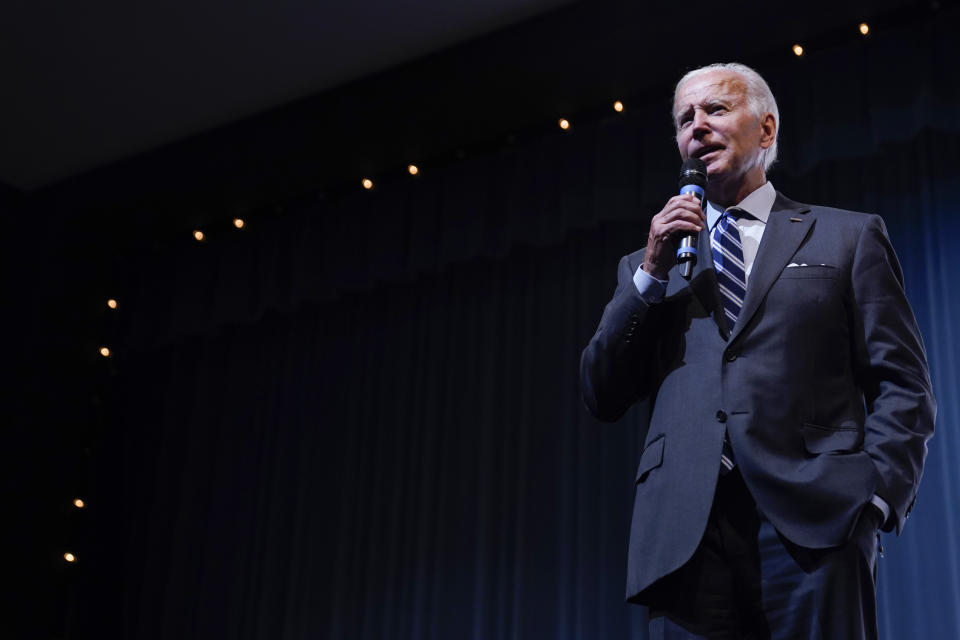 President Joe Biden speaks to a crowd in a overflow room at a rally hosted by the Democratic National Committee at Richard Montgomery High School, Thursday, Aug. 25, 2022, in Rockville, Md. (AP Photo/Evan Vucci)