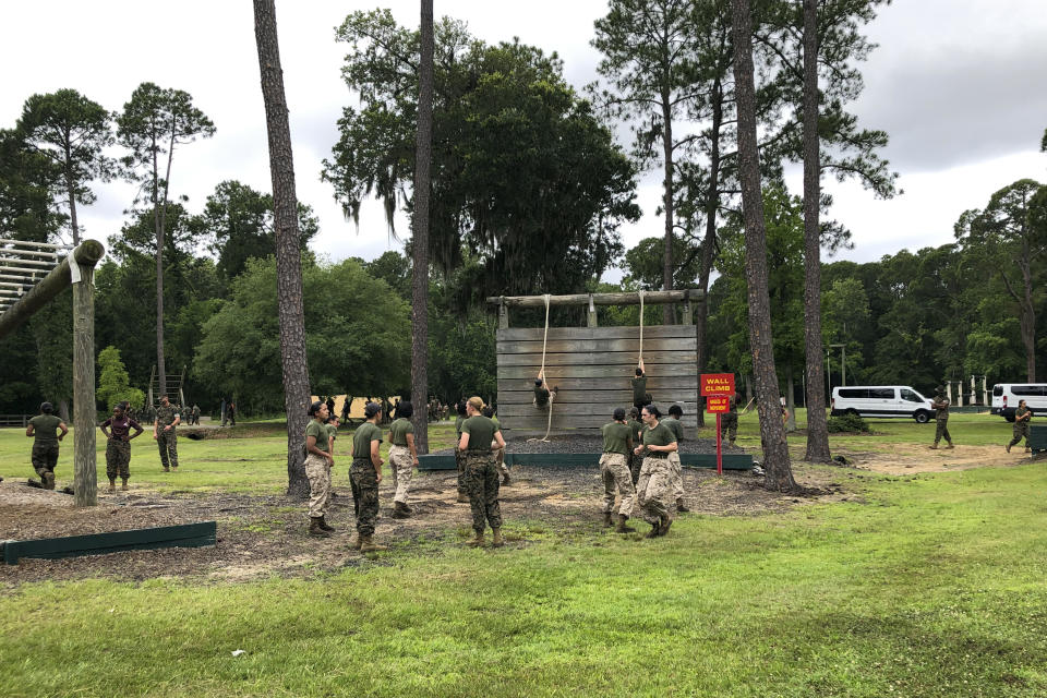 Female Marines go through one of the obstacles in the so-called confidence course at Parris Island Recruit Depot, S.,C., on May 27, 2020, that is designed to make them face their fears and gain confidence. In ways big and small, the virus is impacting training at the Marine Corps' Parris Island Recruit Depot and across the military. (AP Photo/Lolita Baldor)