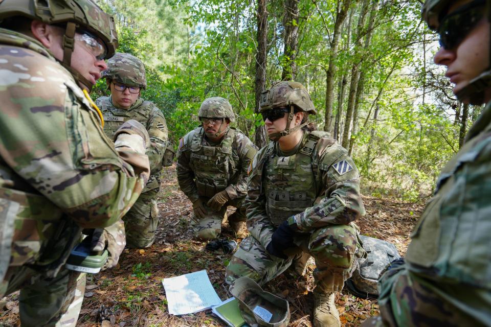 1st Lt. Delaney Hahn works on a call for fire practical exercise with her team at Fort Stewart on March 21, 2023, in Georgia. Women still make up a small portion of positions in combat roles.