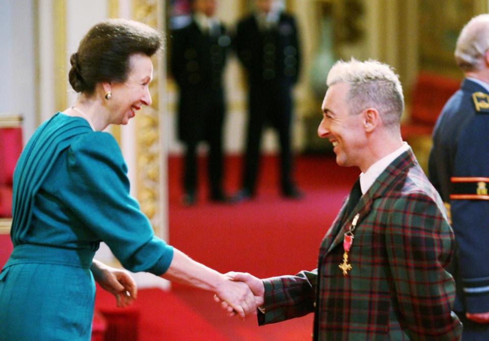 Cumming was made an OBE by Princess Anne for services to film, theatre, the arts and to activism for equal rights for the gay and lesbian community, at Buckingham Palace in 2009 (PA)