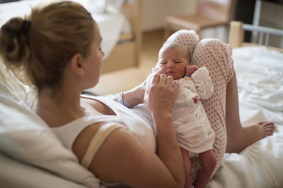 Mother with her newborn baby in the hospital.