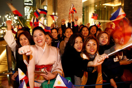 Supporters shout Philippine President Rodrigo Duterte's name as they wait for his arrival at a hotel in Tokyo, Japan October 25, 2016. REUTERS/Kim Kyung-Hoon