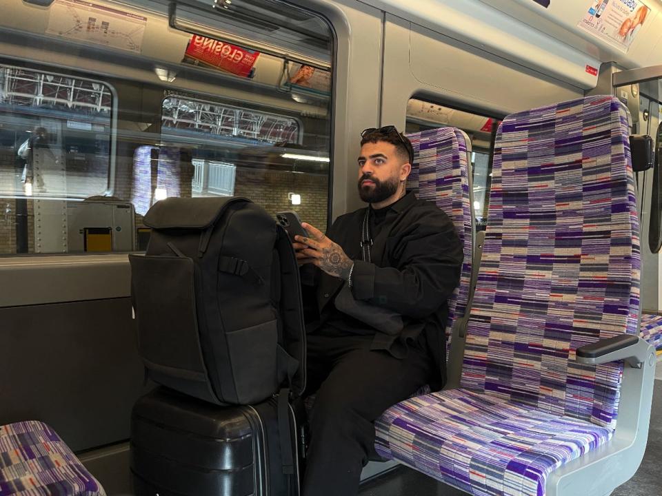 Insider's Sam Tabahriti was photographed sitting in the train.