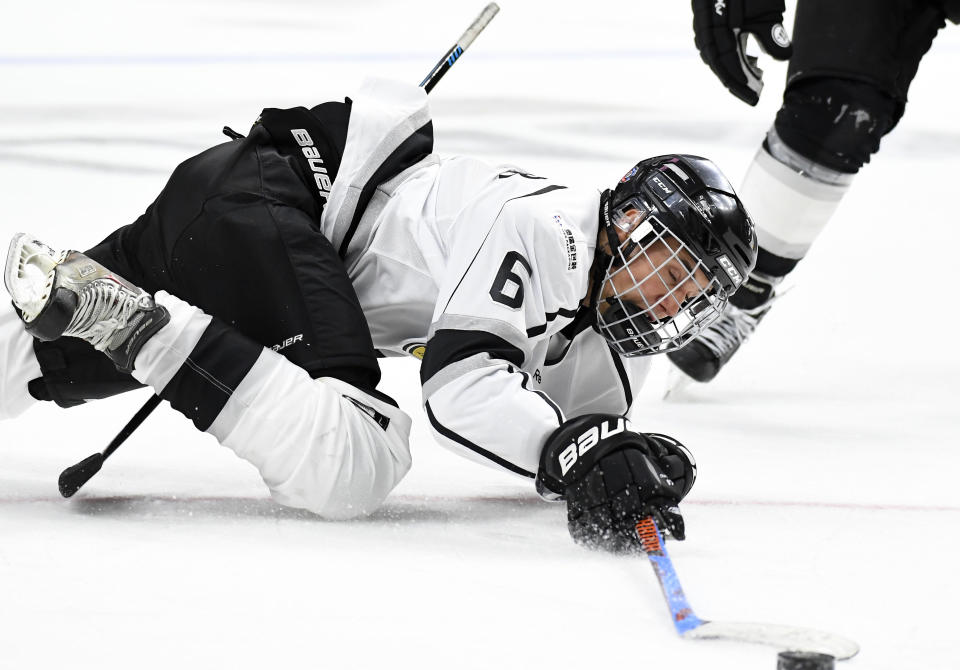 Singer Justin Bieber takes a fall during the first period of the NHL All-Star Celebrity Shootout on Saturday, Jan. 28, 2017, in Los Angeles. The NHL All-Star Game is scheduled to be played Sunday. (AP Photo/Mark J. Terrill)