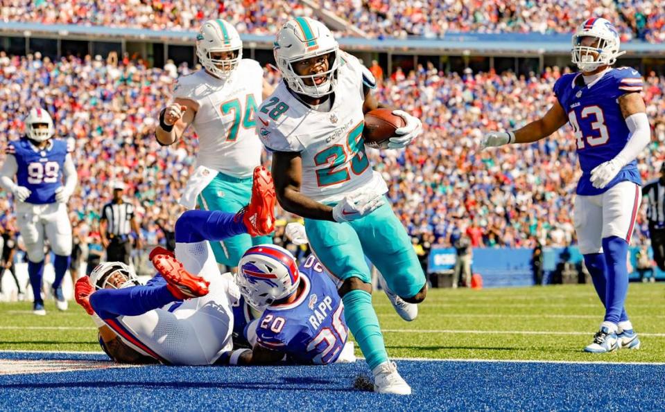 Miami Dolphins running back De’Von Achane (28) scores in the second quarter against the Buffalo Bills at Highmark Stadium in Orchard Park, NY., on Sunday, October 1, 2023.