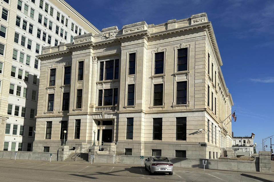 A Kansas Capitol Police car sits outside the building that houses the offices of the Kansas secretary of state after its evacuation, Tuesday, Nov. 14, 2023, in Topeka, Kan. The building was evacuated after the secretary of state's office received suspicious mail. (AP Photo/John Hanna)