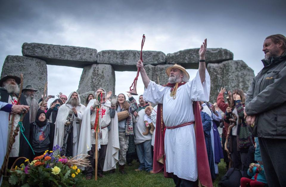 <p>Rollo Maughfling, Archdruid of Stonehenge and Britain, conducts a ceremony at Stonehenge to celebrate the autumnal equinox on September 23, 2017, in Wiltshire, England. </p>