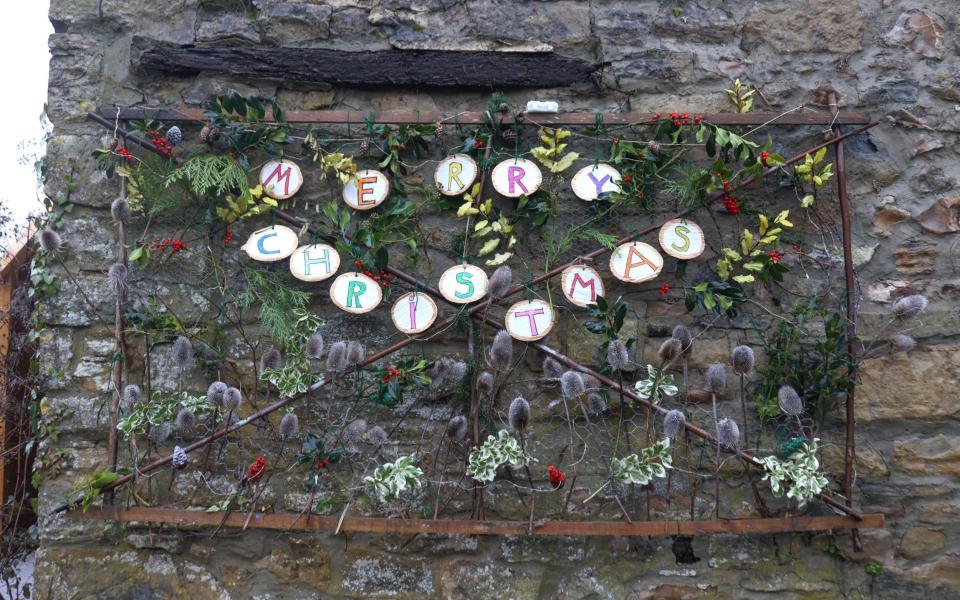 Villagers have decorated their houses with advent calendar decorations after Boudicca's mother kickstarted the trend - John Lawrence
