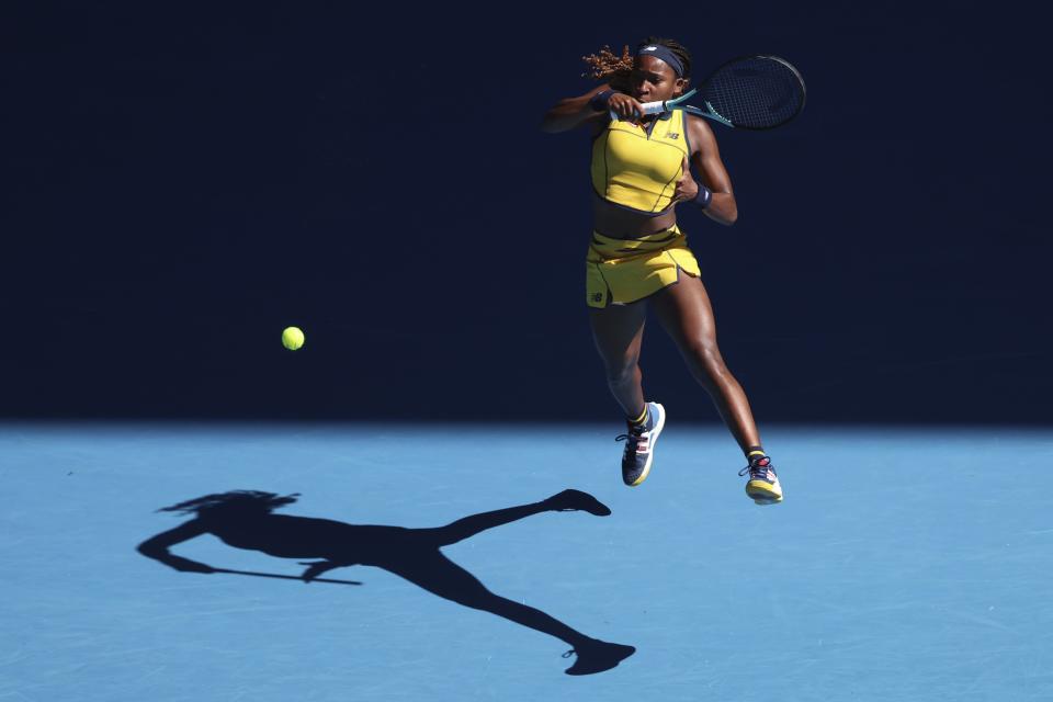 Coco Gauff of the U.S. plays a forehand return to Marta Kostyuk of Ukraine during their quarterfinal match at the Australian Open tennis championships at Melbourne Park, Melbourne, Australia, Tuesday, Jan. 23, 2024. (AP Photo/Asanka Brendon Ratnayake)