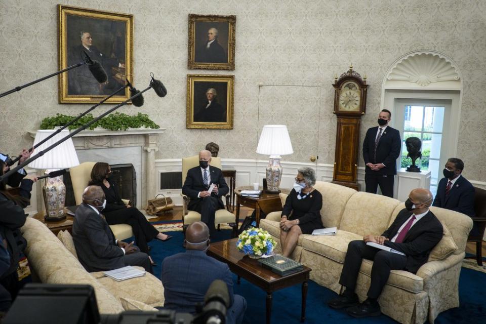 U.S. President Joe Biden (C) and Vice President Kamala Harris (2nd L) meet with members of the Congressional Black Caucus, including House Majority Whip James Clyburn (D-SC), Sen. Raphael Warnock (D-GA), Rep. Joyce Beatty (D-OH) and Sen. Cory Booker (D-NJ), in the Oval Office at the White House on April 13, 2021 in Washington, DC. (Photo by Pete Marovich-Pool/Getty Images)