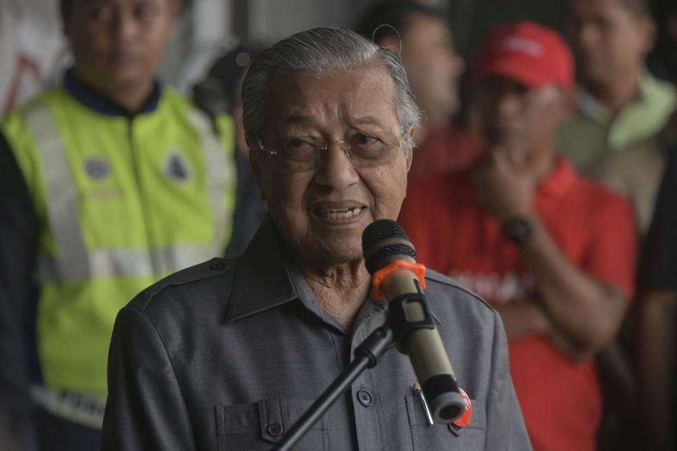 Pakatan Harapan chairman Dr Mahathir Mohamad delivers a speech while campaigning in Pekan Nanas, Pontian November 14, 2019. — Picture by Shafwan Zaidon