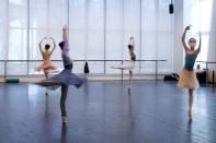 Shanghai Ballet dancers wearing masks practise in a dance studio in Shanghai