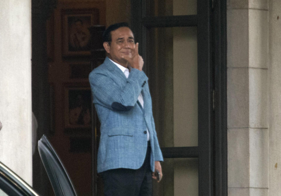 Thai Prime Minister Prayuth Chan-ocha leaves the government house in Bangkok, Thailand, Friday, Feb. 8, 2019. Prayuth, who led the 2014 coup that ousted Thailand's last elected government, on Friday accepted his selection as candidate to lead the next government by Palang Pracharat Party, widely seen as a proxy for the military. (AP Photo/Sakchai Lalit)