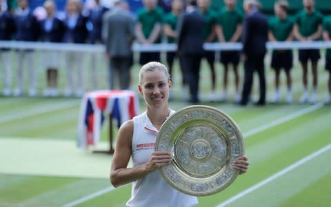 Angelique Kerber poses with the trophy after winning the women's singles final match against Serena Williams of the United States, at the Wimbledon Tennis Championships, in London, Saturday July 14, 2018 - Credit: AP