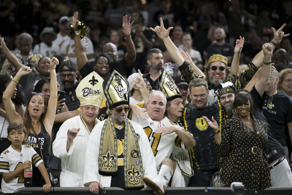 New Orleans Saints fans celebrate during the second half of an NFL football game against the Carolina Panthers, Sunday, Sept. 8, 2024, in New Orleans. (AP Photo/Matthew Hinton)