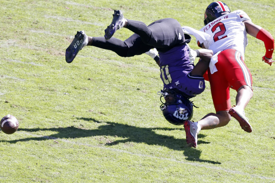 TCU wide receiver Blair Conwright (0) is upended by Texas Tech defensive back Reggie Pearson Jr. (2) on an incomplete pass during the second half of an NCAA college football game Saturday, Nov. 5, 2022, in Fort Worth, Texas. (AP Photo/Ron Jenkins)