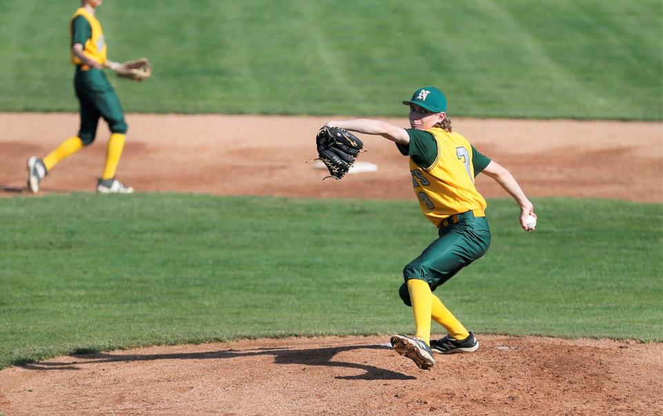 Northeastern freshman Logan White throws a warmup pitch during a Wayne County Tournament game May 14, 2022.