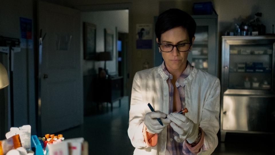 Annabeth Gish as Doctor Sarah in her lab in Midnight Mass.