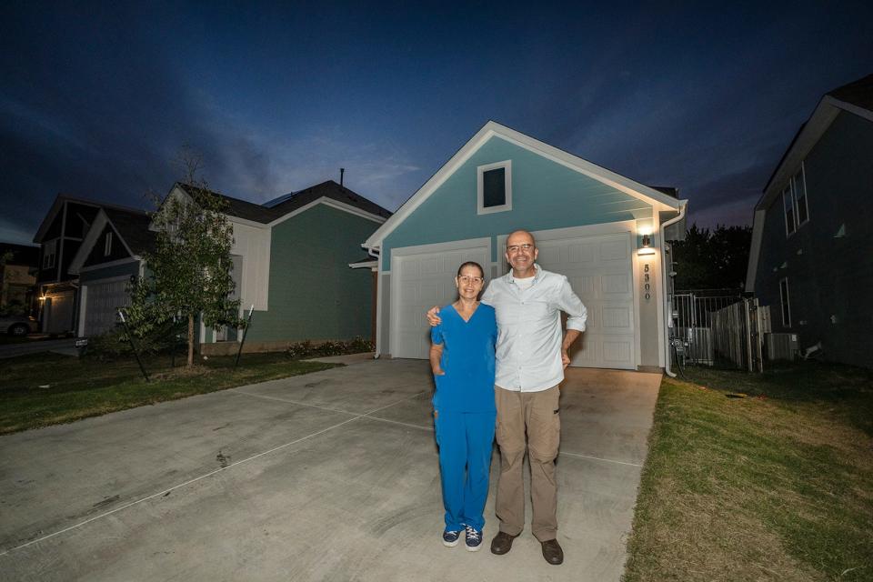 “Everybody knows it is very hard, very hard to get an affordable house” in Austin, said Jorge González, shown with wife Ana Teresa Vidail outside their new home.