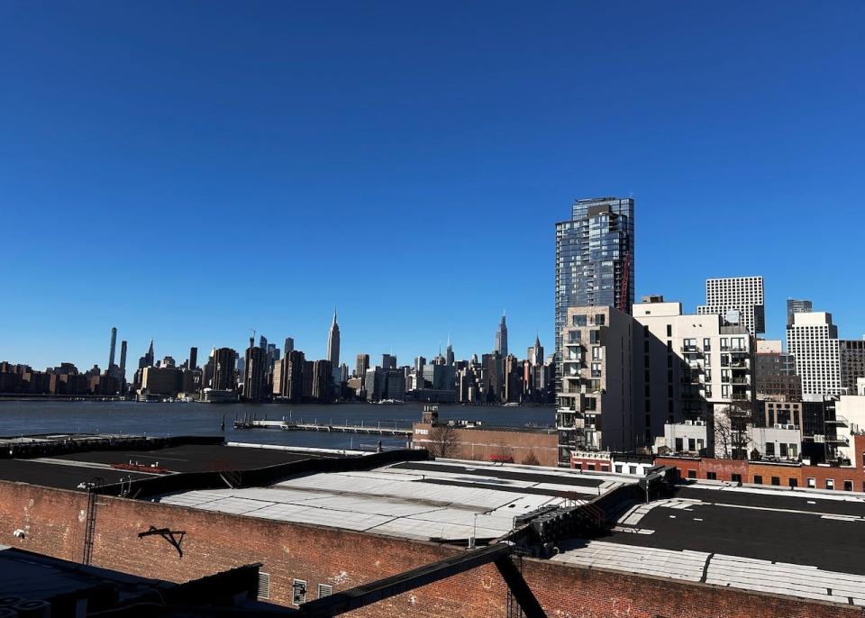 View of Long Island City and Manhattan from rooftop, Greenpoint, Brooklyn, New York.