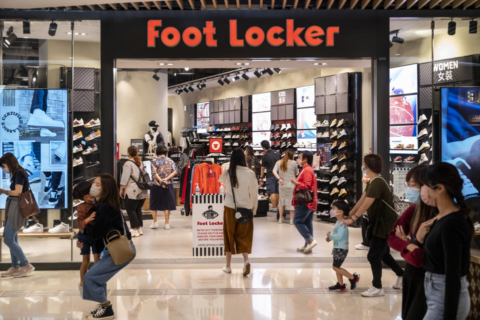 HONG KONG, CHINA - 2022/01/02: Shoppers walk past the American multinational sportswear and footwear retailer, Foot Locker store in Hong Kong. (Photo by Budrul Chukrut/SOPA Images/LightRocket via Getty Images)