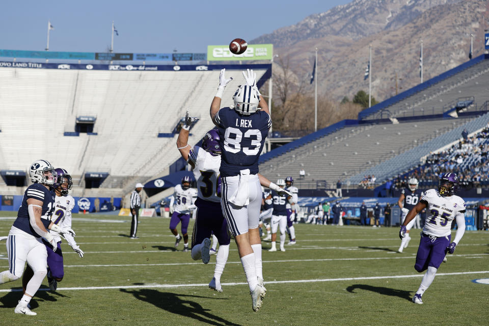 BYU tight end Isaac Rex (83) makes a reception for a touchdown over North Alabama linebacker Jakob Cummings (36) in the first quarter during an NCAA college football game Saturday, Nov. 21, 2020, in Provo, Utah. (AP Photo/Jeff Swinger, Pool)