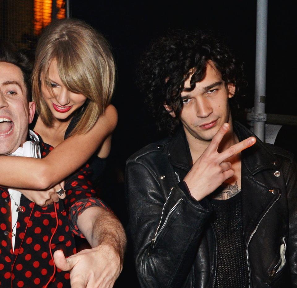 Taylor Swift and Matty Healy with British DJ Nick Grimshaw in 2015