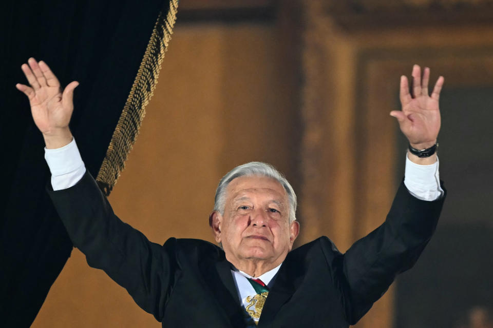 Mexican President Andres Manuel Lopez Obrador bids farewell to his supporters during his last public act as president at the 'Grito de Independencia' ceremony, which marks the start of Independence Day celebrations at El Zocalo Square in Mexico City on September 15, 2024.