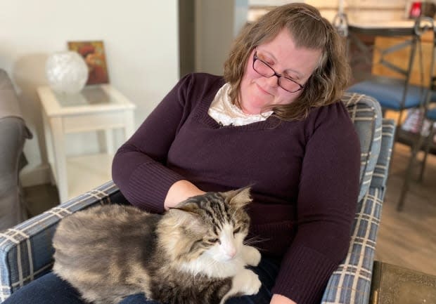 It took four days but Harrison the cat finally jumped on Eileen Hendry's lap after he was in his new home with her. 'He was definitely showing that he was interested in having me for company and getting close to me,' she said.