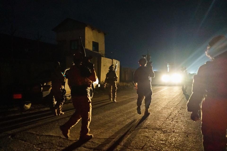 Taliban fighters from the Fateh Zwak unit storm into the Kabul International Airport, wielding American-supplied weapons, equipment and uniforms on Aug. 31, 2021.