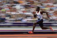 Britain's Dwain Chambers competes during round 1 of the men's 100m heats at the London 2012 Olympic Games at the Olympic Stadium August 4, 2012.