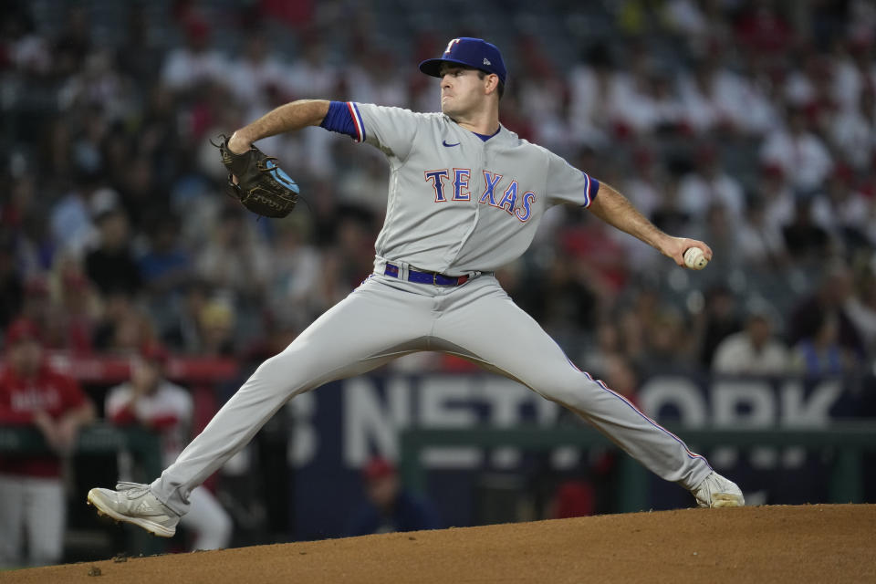 Texas Rangers starting pitcher Cody Bradford (61) throws during the first inning of a baseball game against the Los Angeles Angels in Anaheim, Calif., Tuesday, Sept. 26, 2023. (AP Photo/Ashley Landis)