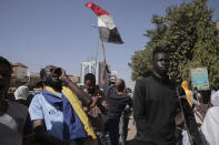 People protests against the October military coup and subsequent deal that reinstated Prime Minister Hamdok in Khartoum, Sudan, Monday, Dec. 6, 2021. (AP Photo/Marwan Ali)