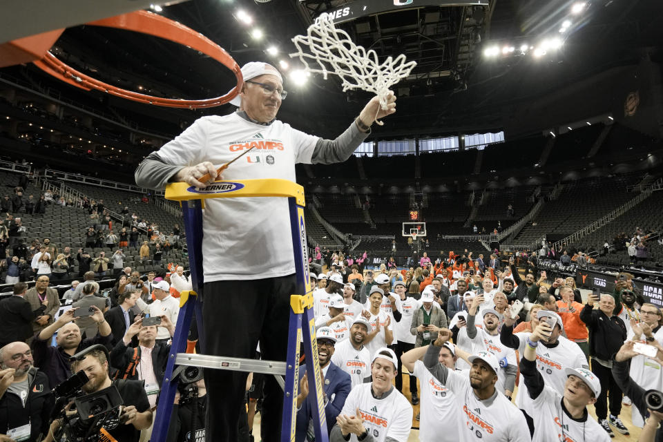 Miami head coach Jim Larranaga celebrates during the net cutting after their win against Texas in an Elite 8 college basketball game in the Midwest Regional of the NCAA Tournament Sunday, March 26, 2023, in Kansas City, Mo. (AP Photo/Charlie Riedel)