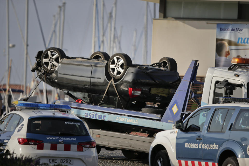 An overturned car is transported