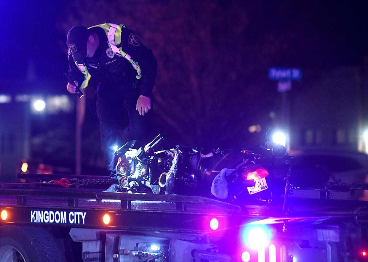 A Columbia police officer looks at a motorcycle that was involved in a fatal accident shortly after 5 p.m. Tuesday on Providence Road near East Sexton Road.